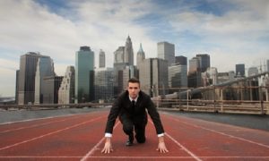 Man-on-starting-track-line-in-suit-and-NY-Skyline-500x300